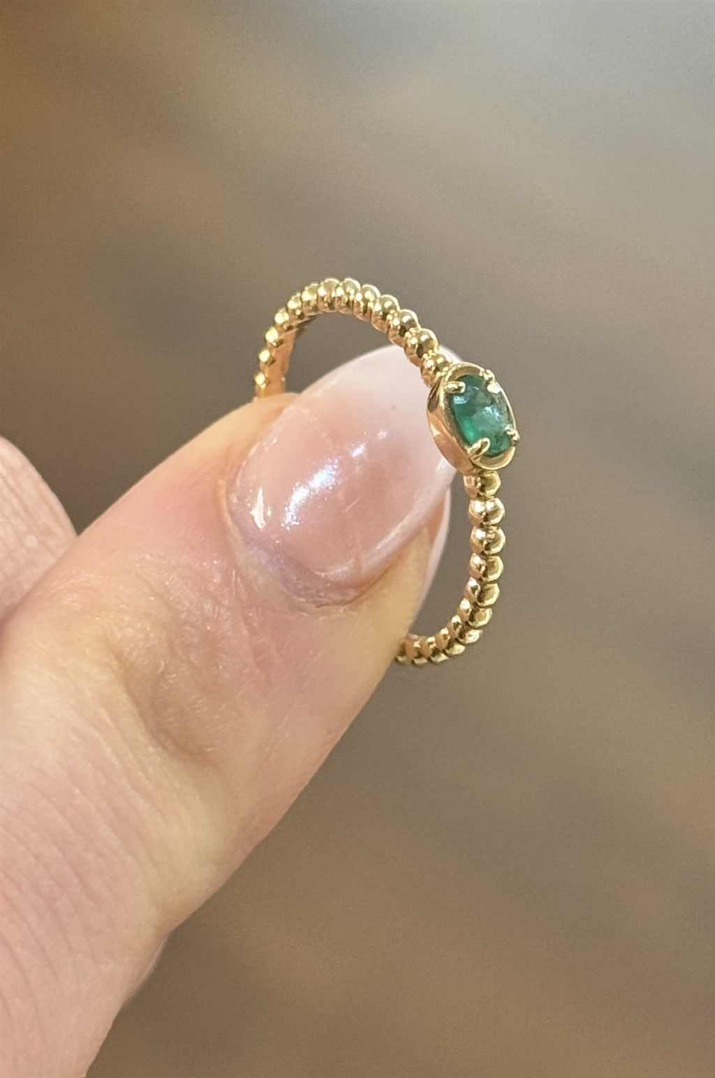 14ktYG Ring with 0.15ct oval E