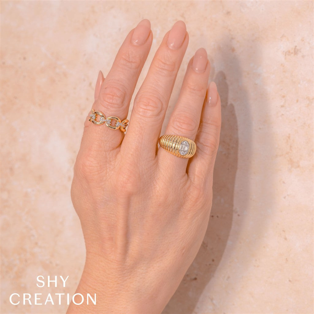 0.28CT 14K2T Y/W DIAMOND BAGUE